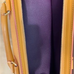 Luis Vuitton authentic yellow with purple interior rectangular.